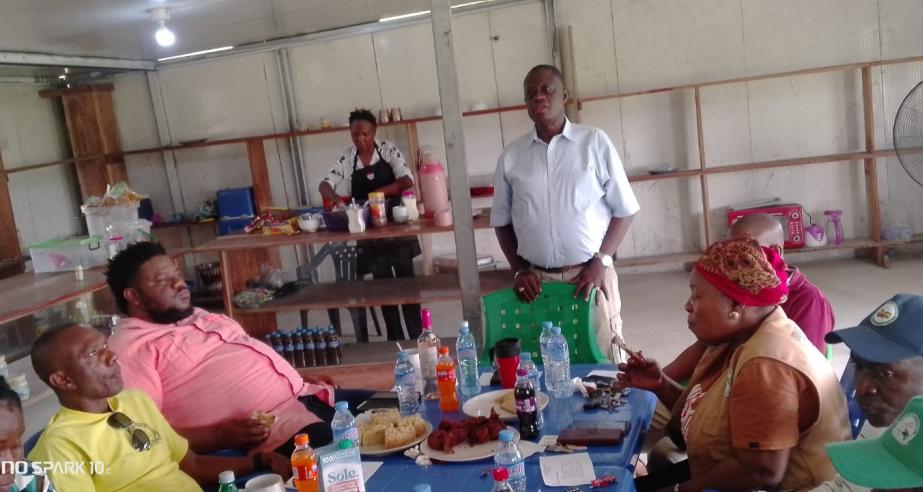 Dr. Arthur Bob Karnuah addresses professional staff during the coffee break