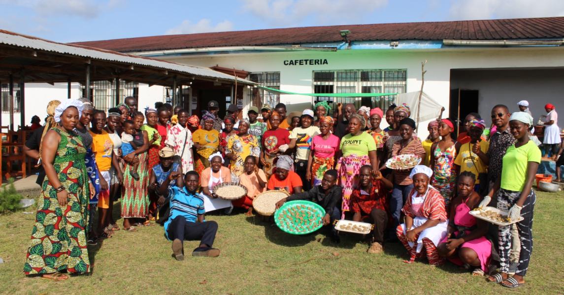 Farmers and food science students proudly display an array of nutritious dishes prepared from local crops during the Grand Bassa Farmer Field School, showcasing innovation in community-based recipe development.