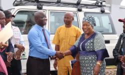 Minister Nuetah handover keys to Mrs. Kromah as Mr. Momo and Joseph Woah look on.