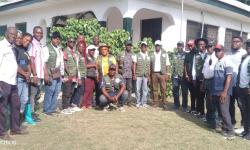 The arrival of Director General Dr. Arthur Bob Karnuah, accompanied by CARI management staff and researchers, standing before the field office at the Beeplay hub in Buuyao District, Nimba County.   
