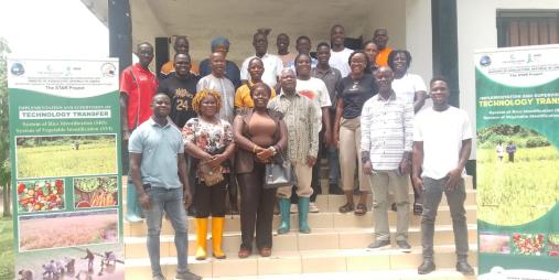 Dr. Arthur Bob Karnuah, CARI Director General, Jobson Momo, SDCA Director General, flanked by participants, including Research Assistants, smallholder farmers, women, and youth groups.