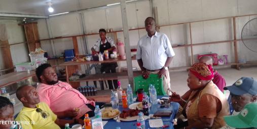 Dr. Arthur Bob Karnuah addresses professional staff during the coffee break